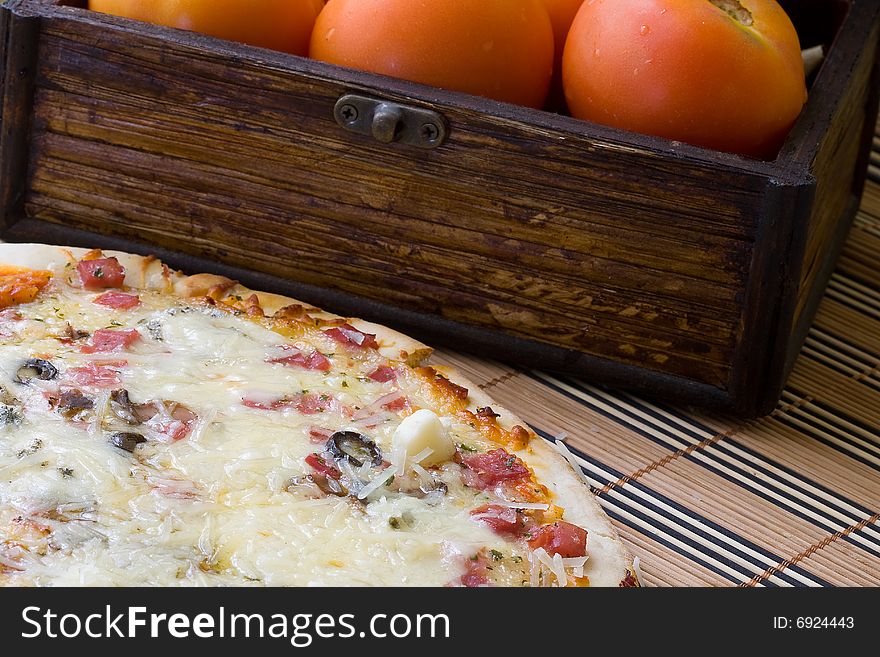 Tasty gorgonzola cheese pizza with black olives on red background