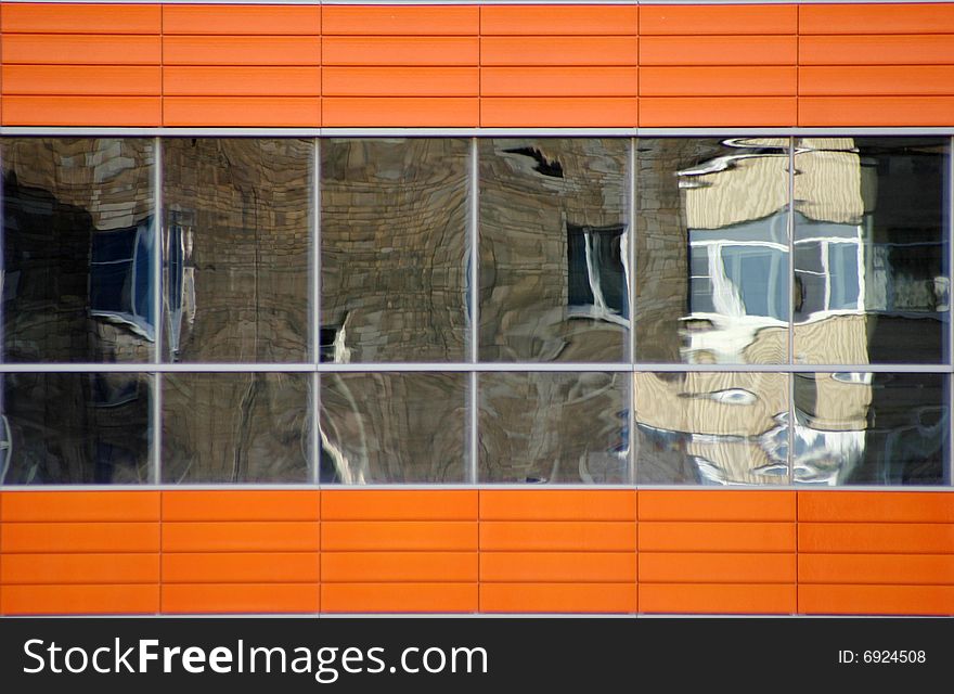 Distorted reflections of a brick wall in windows. Distorted reflections of a brick wall in windows