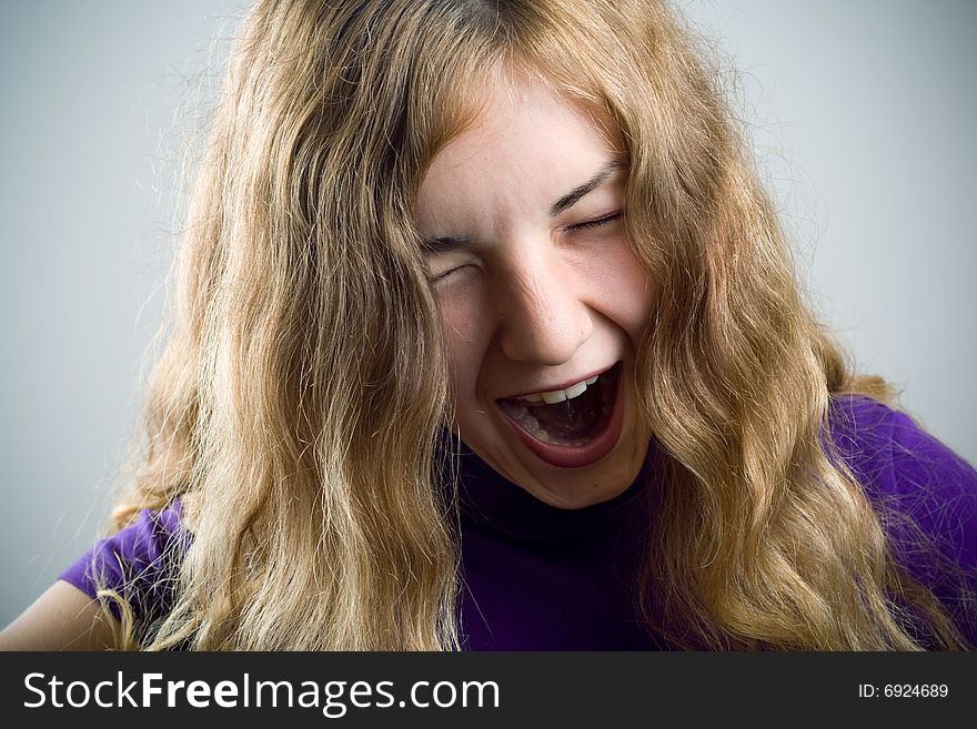 Screaming young girl with closed eyes. Screaming young girl with closed eyes.