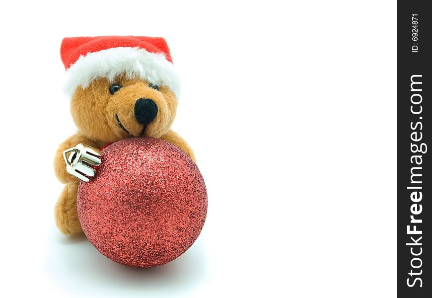 Teddy Bear and  Christmas bauble isolated on white background.