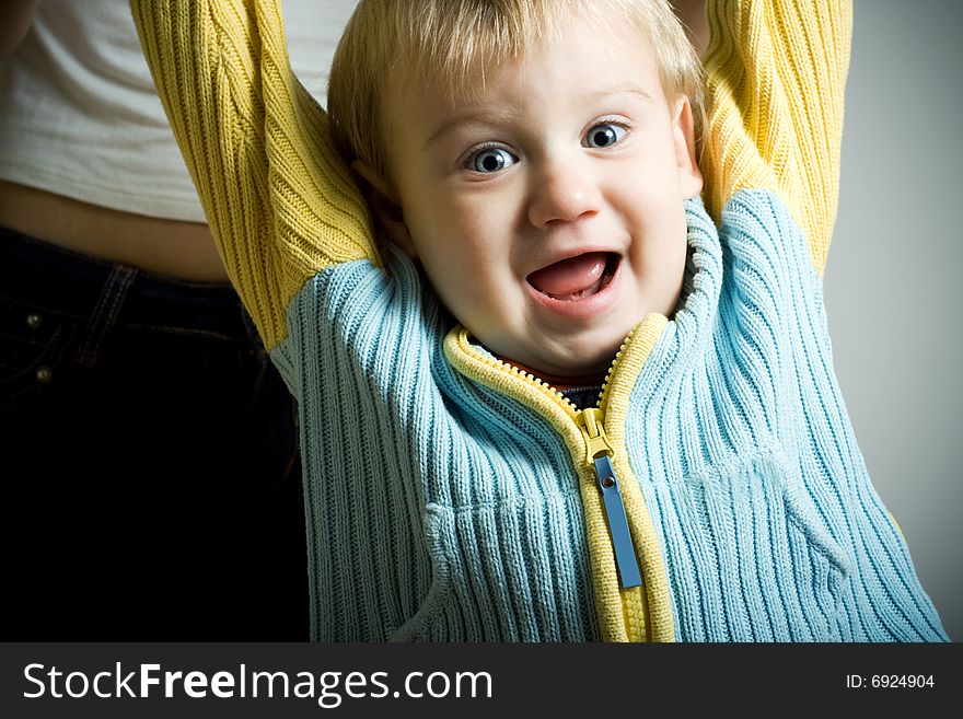 Happy little boy screaming and looking at camera. Happy little boy screaming and looking at camera.