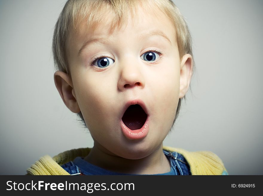 Little boy screaming and looking at camera. Little boy screaming and looking at camera.