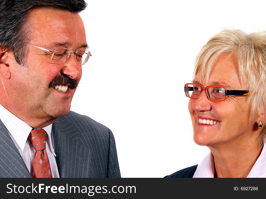 A business woman and a man looking at each other. Isolated over white. A business woman and a man looking at each other. Isolated over white.