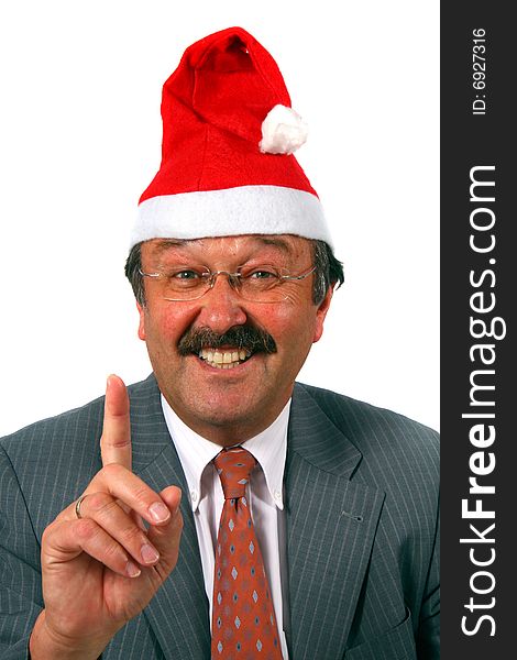 A senior businessman dressed up with a hat as Santa claus. Isolated over white. A senior businessman dressed up with a hat as Santa claus. Isolated over white.