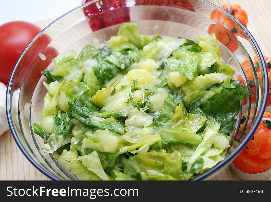 A fresh salad of romana salad and potatoes