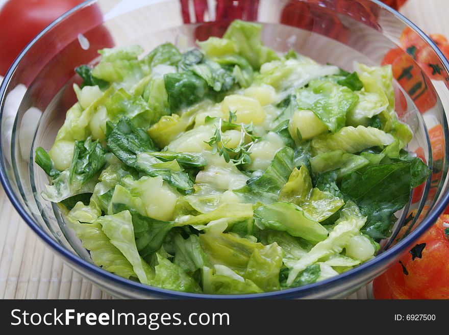 A meal of a fresh salad with potatoes