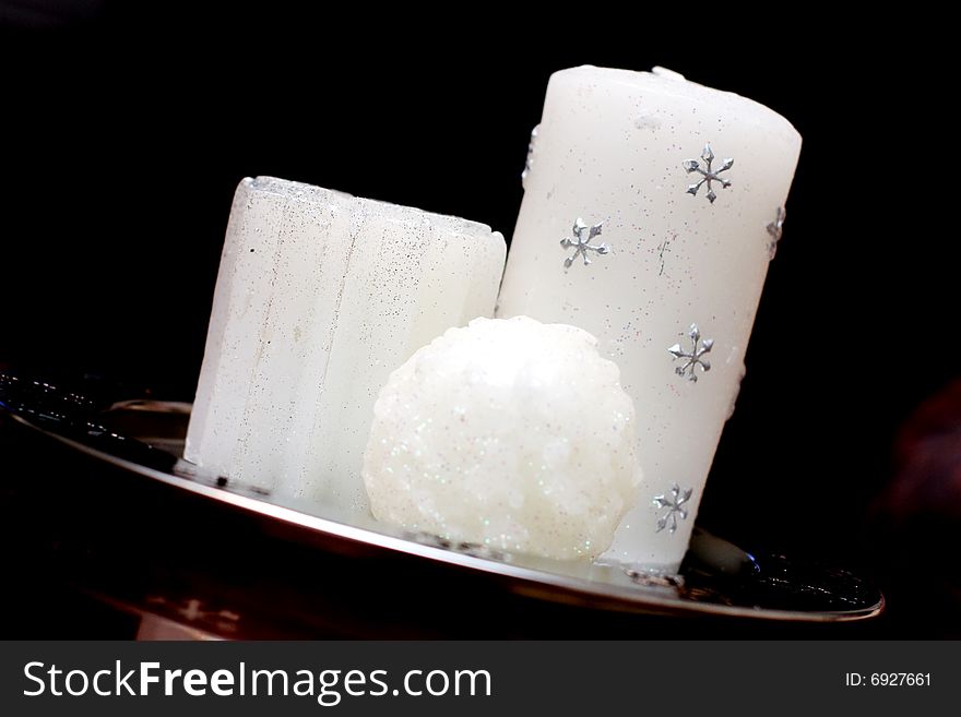 White christmas candles with silver snowflakes. White christmas candles with silver snowflakes