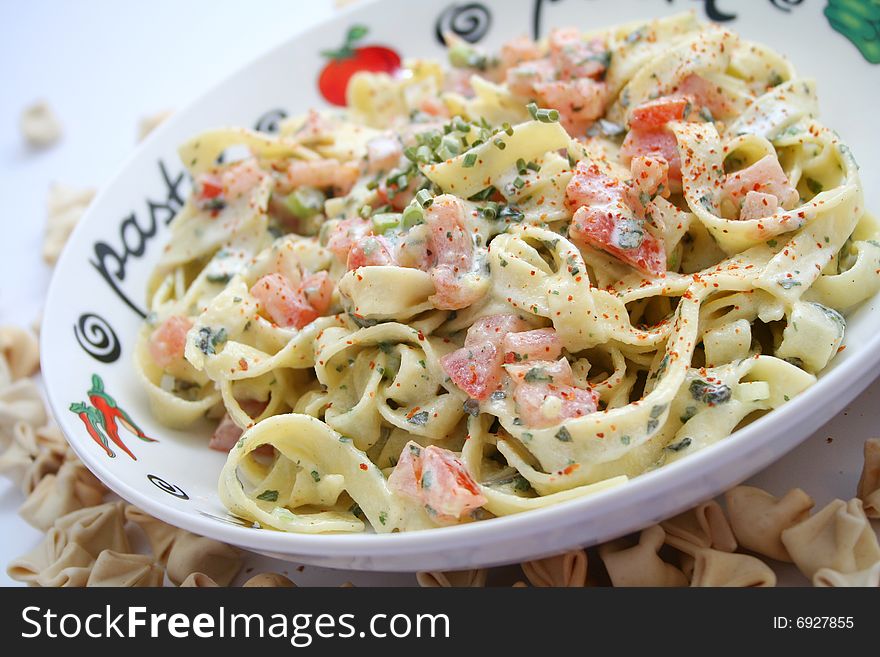 A meal of fresh italian pasta with tomatoes. A meal of fresh italian pasta with tomatoes