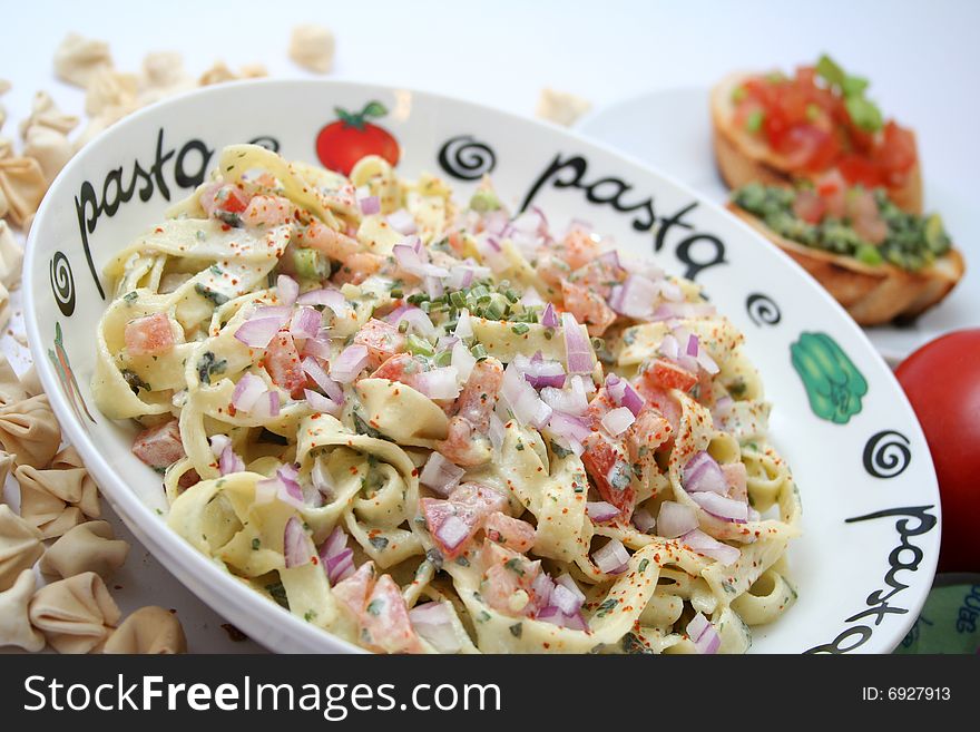 A meal of fresh italian pasta with tomatoes. A meal of fresh italian pasta with tomatoes