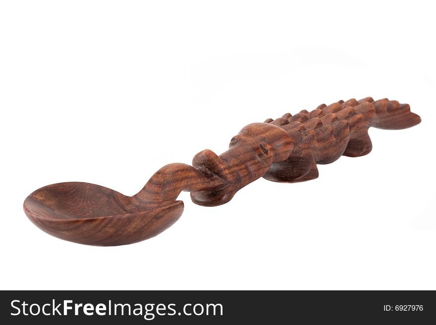 A carved spoon in the shape of a crocodile