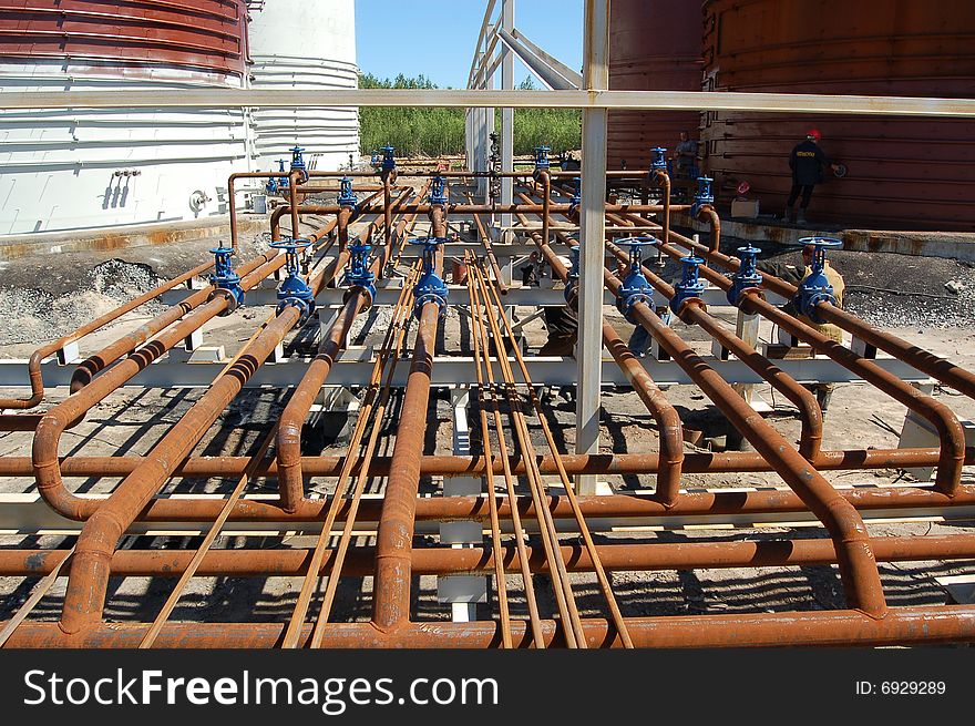 Metal pipes and valve at oil-factory