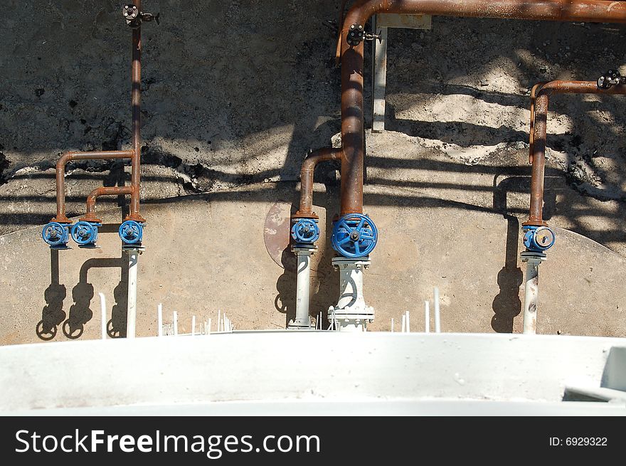 Metal pipes and valve at oil-factory