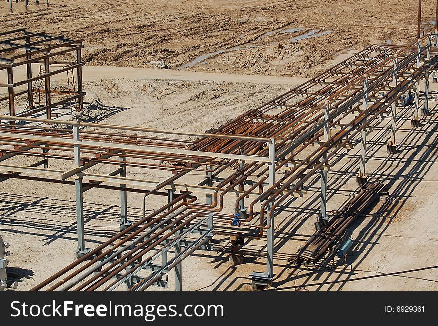 Metal pipes at oil-factory buildings