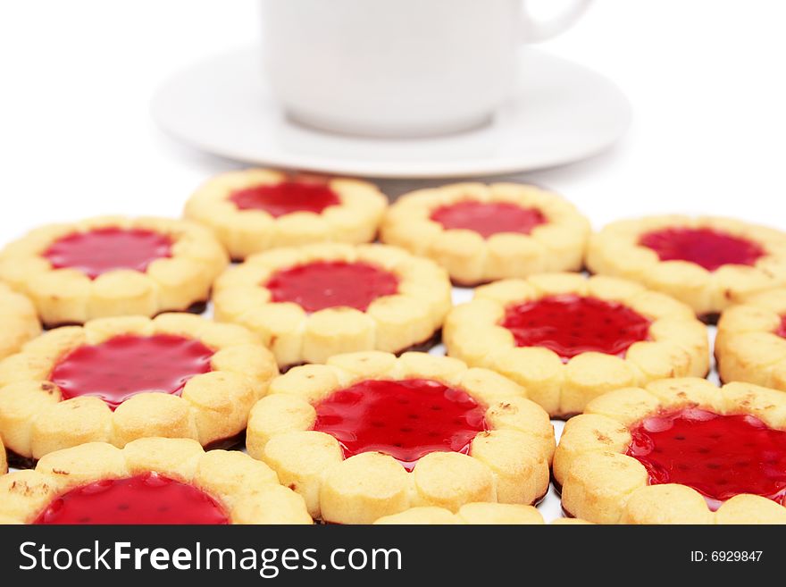 Cup of tea and cookies on foreground isolated on white. Cup of tea and cookies on foreground isolated on white.