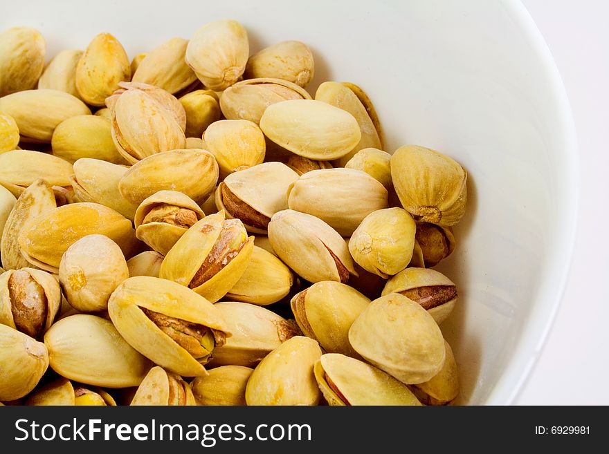 Bowl of tasty pistachios closeup. Bowl of tasty pistachios closeup