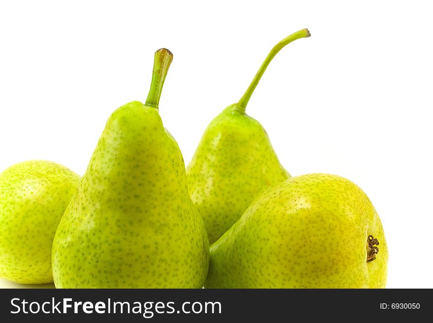 Closeup of four pears on white