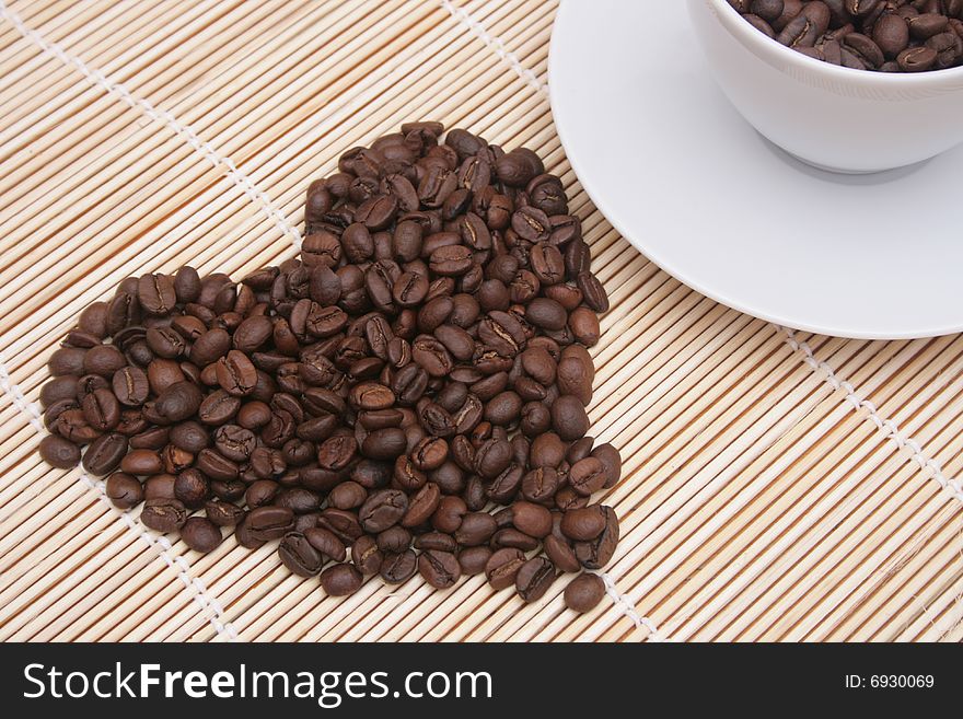 Heart of coffee beans with coffee cup. Heart of coffee beans with coffee cup.