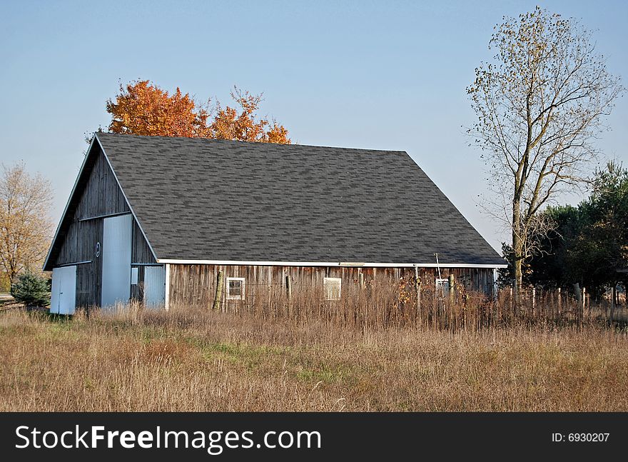 Old barn on an October afternoon. Old barn on an October afternoon.