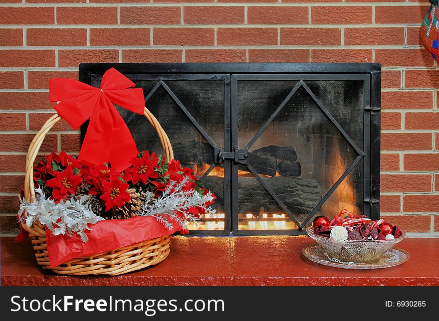 Fire place with Xmas basket and ornaments with fire glowing. Fire place with Xmas basket and ornaments with fire glowing.