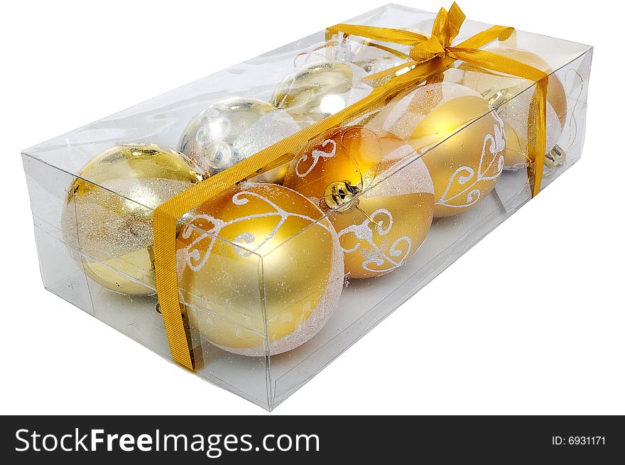 Christmas set of eght shiny balls inside of transparent box, isolated on white background