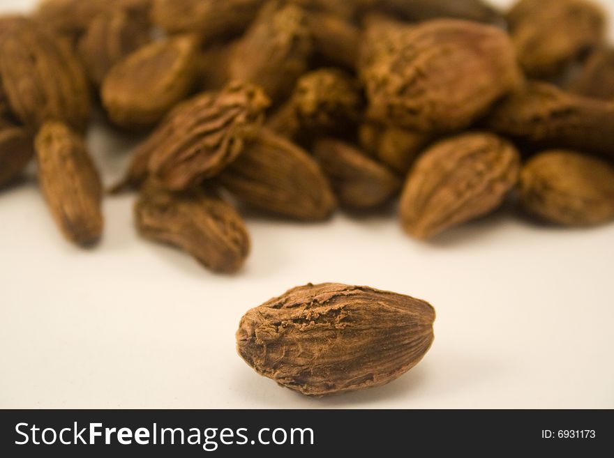 Black cardamom isolated on white