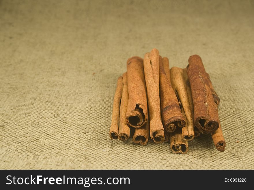 Whole cinnamon sticks on burlap