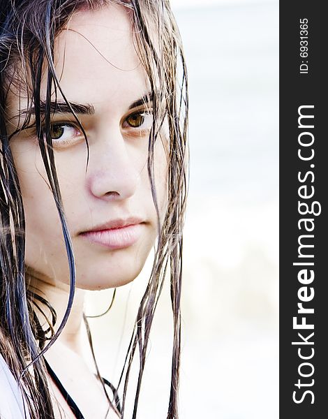 Beautiful green eyed woman portrait with wet hair.