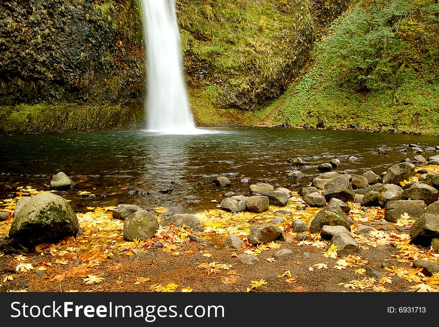 Landscape of a fall waterfall. Landscape of a fall waterfall