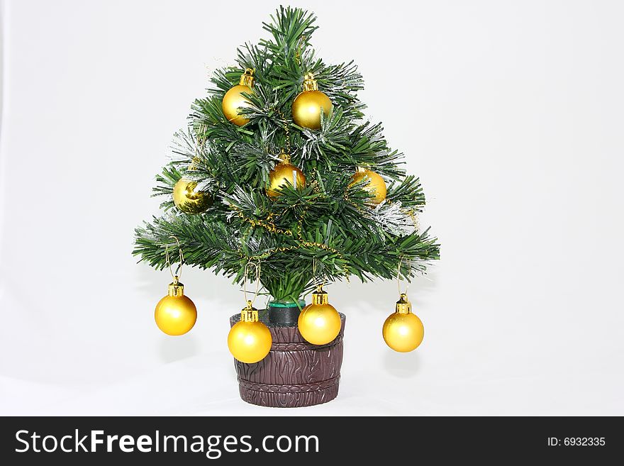 Small plastic christmas tree isolated on white background