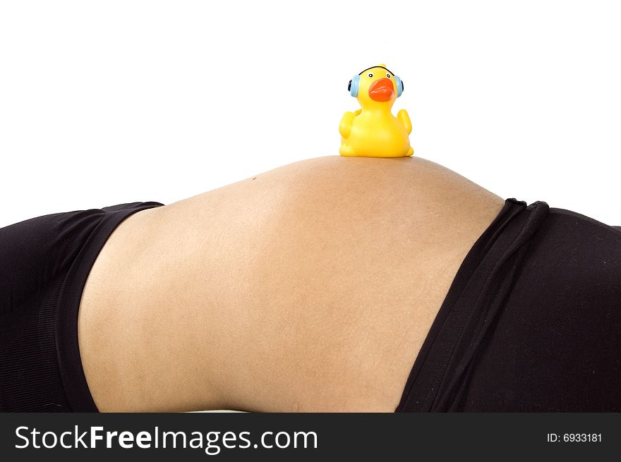 30 weeks pregnant teenager with music duck on her belly