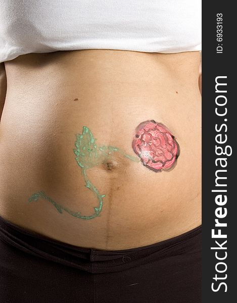 30 weeks pregnant teenager with a flower on her belly
