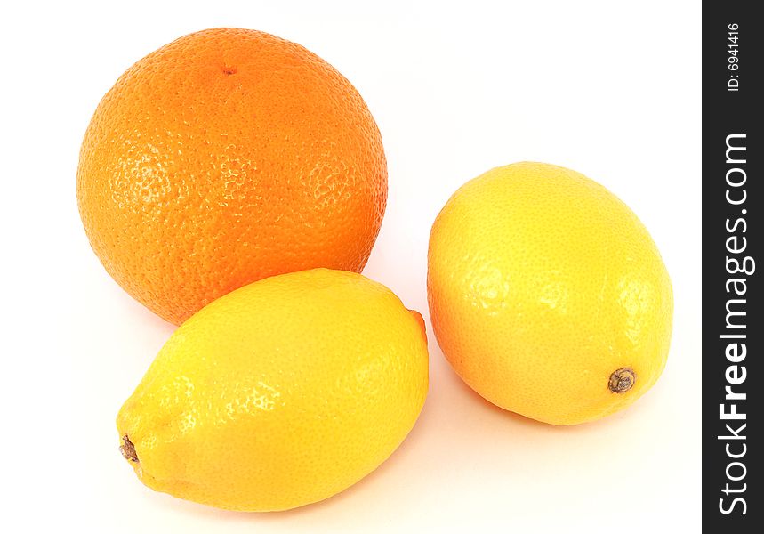 Orange and two lemons, isolated on white