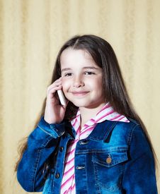 Girl In A Blue Denim Jacket Talking On A Phone Royalty Free Stock Photos Girl In A Blue Denim Jacket Talking On A Phone Royalty Free Stock Photos