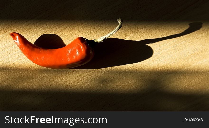 Red hot chili pepper with shadow. Red hot chili pepper with shadow.