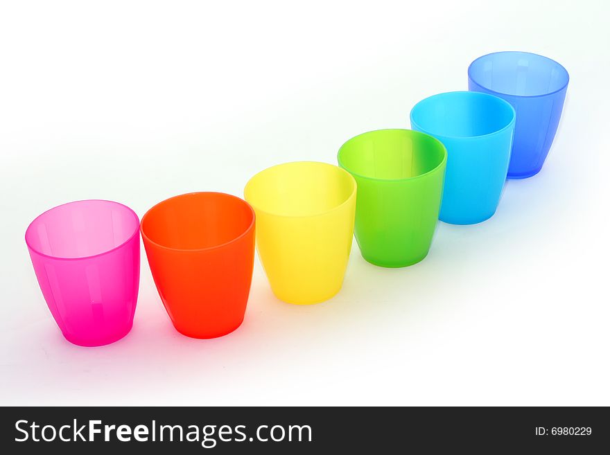 Colorful plastic cups on white background. Colorful plastic cups on white background