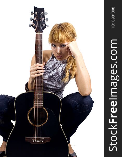 Pretty, blonde girl holding guitar, sad face expression, close portrait. Pretty, blonde girl holding guitar, sad face expression, close portrait.