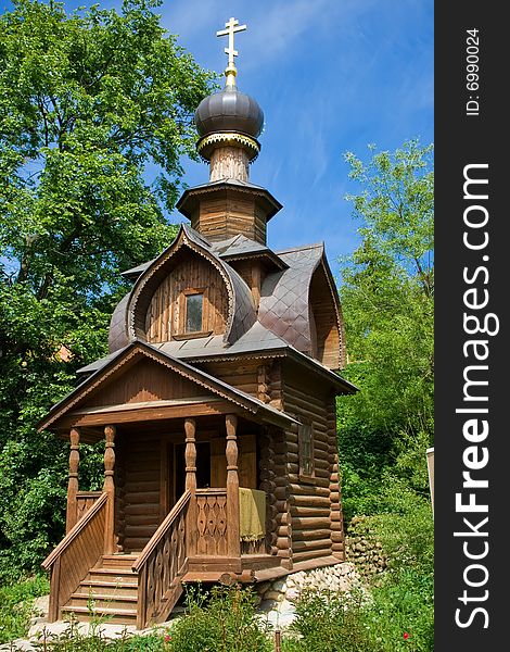 An old orthodox log wooden chapel near St. Sava's spring, Sergiev Posad, Russia. An old orthodox log wooden chapel near St. Sava's spring, Sergiev Posad, Russia