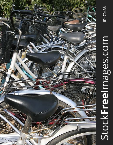 Bicycles crammed into a parking area in Kyoto, Japan. Bicycles crammed into a parking area in Kyoto, Japan.