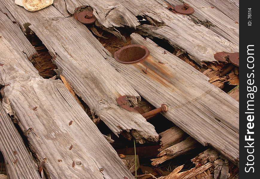 Wooden spool rotten and falling apart. Wooden spool rotten and falling apart