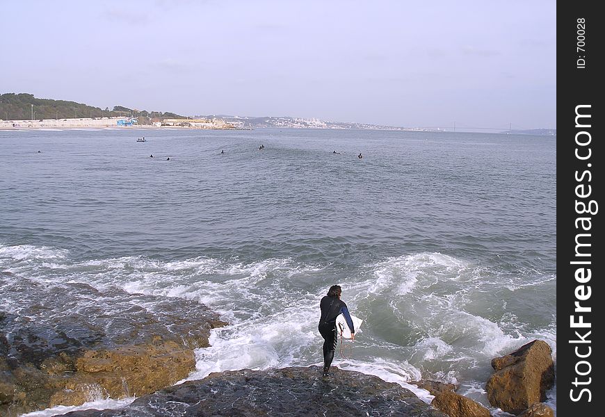 Surfer entering the ocean. Surfer entering the ocean