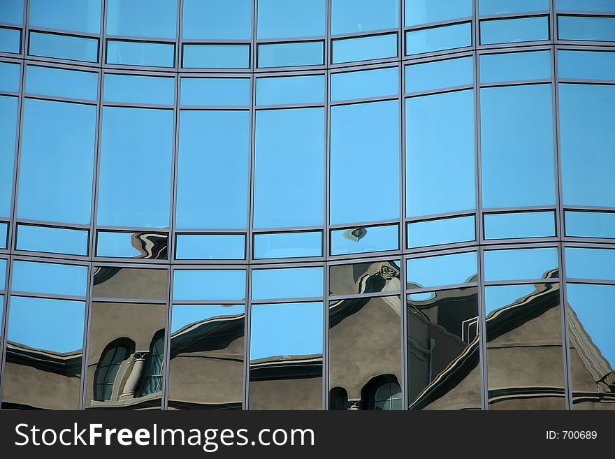 Reflections in a glass wall of a skyscraper