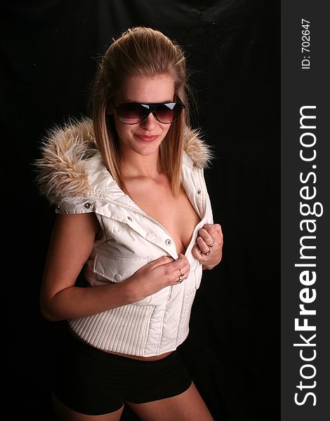 Model wearing a ski jacket and shades. Model wearing a ski jacket and shades