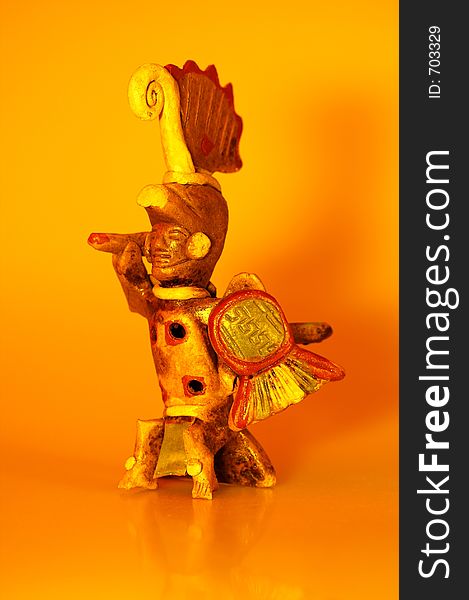 An Aztec Warrior figurine from Mexico that can be played as an ocarina. This version has fiery lighting and shadow play. An Aztec Warrior figurine from Mexico that can be played as an ocarina. This version has fiery lighting and shadow play.