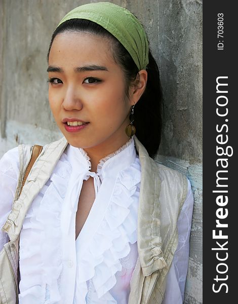 Beautiful Asian woman wearing a white shirt and denim skirt. Beautiful Asian woman wearing a white shirt and denim skirt