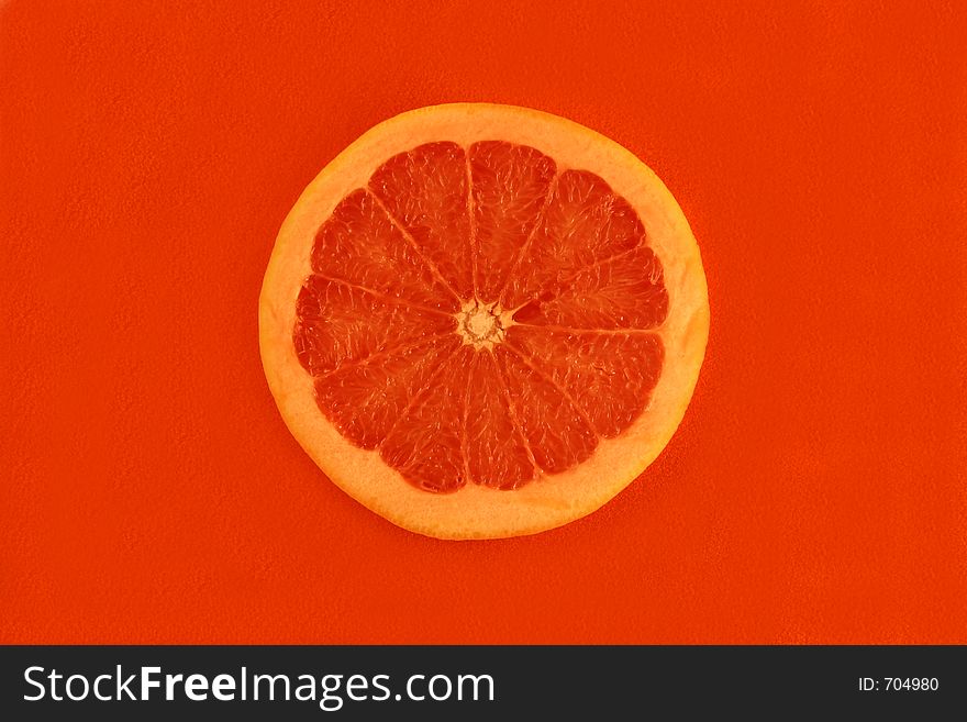 Grapefruits zoom in red background