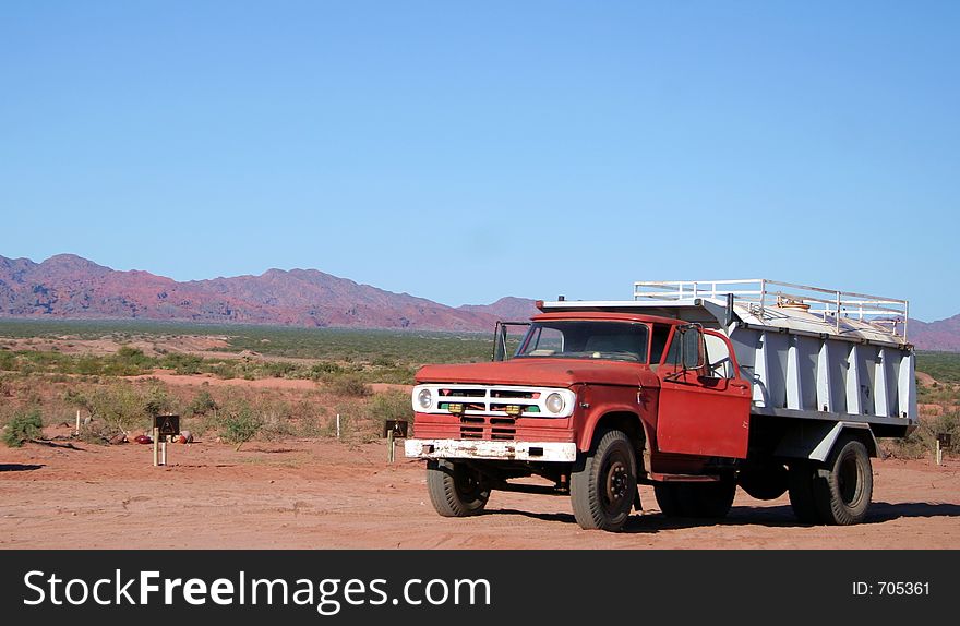 A red truck in the desert