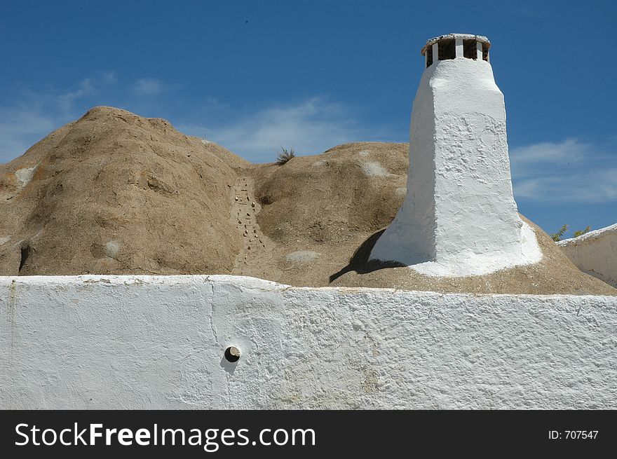 Roof and chimney of a cave home in Guadix, southern Spain. Roof and chimney of a cave home in Guadix, southern Spain