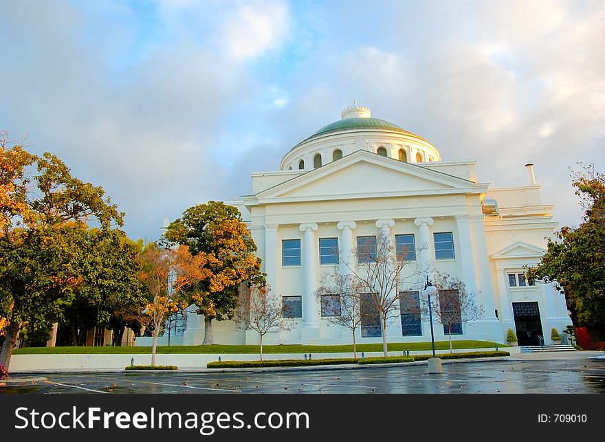 Big white church and clouds