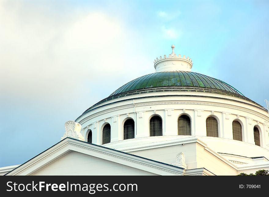 Big white church with green roof