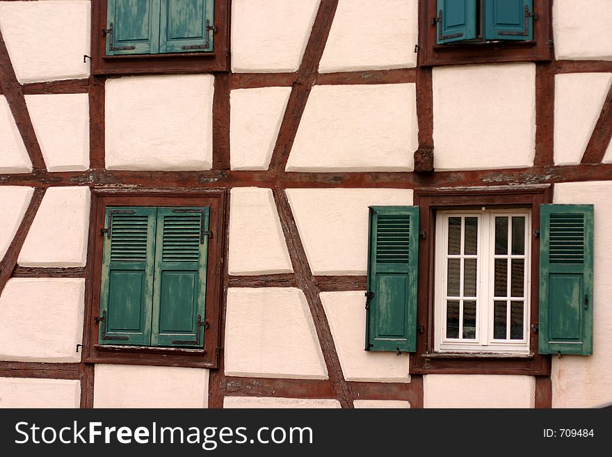 In the street of a alsacian villlage in the summer, half timbered traditional house. In the street of a alsacian villlage in the summer, half timbered traditional house